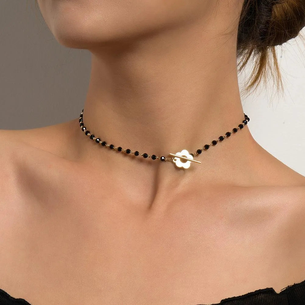 Collana di Perline Nere con Fiore Oro